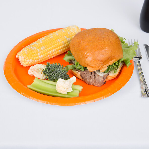 A plate with a sandwich and corn on the cob.