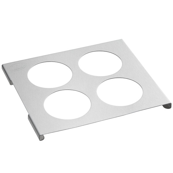 A white metal plate with four circles.
