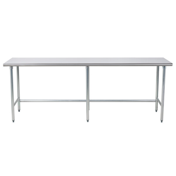 A stainless steel Advance Tabco work table with metal legs and an open base.