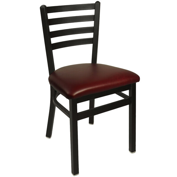 A BFM Seating black steel side chair with a burgundy vinyl seat.