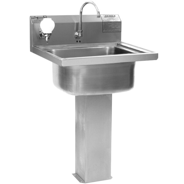 A stainless steel Eagle Group pedestal hand sink with an electronic faucet.