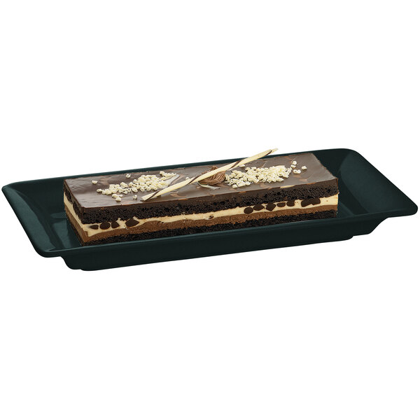 A chocolate cake on a black Tablecraft cast aluminum rectangle platter.