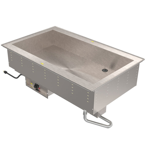 A Vollrath stainless steel drop-in hot food well with three compartments over a stainless steel counter.