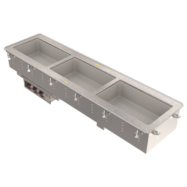 A Vollrath drop-in hot food well with four compartments on a counter.
