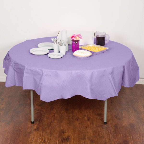 A table with a luscious lavender purple Creative Converting tablecloth, plates, and cups.