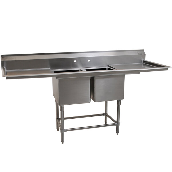 A stainless steel Eagle Group 2 compartment sink with two 24" drainboards.