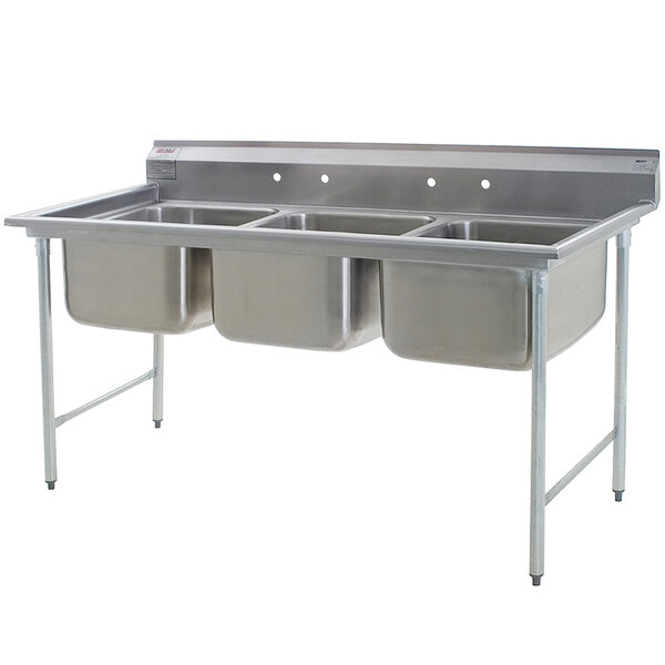A stainless steel Eagle Group three compartment sink on a counter.