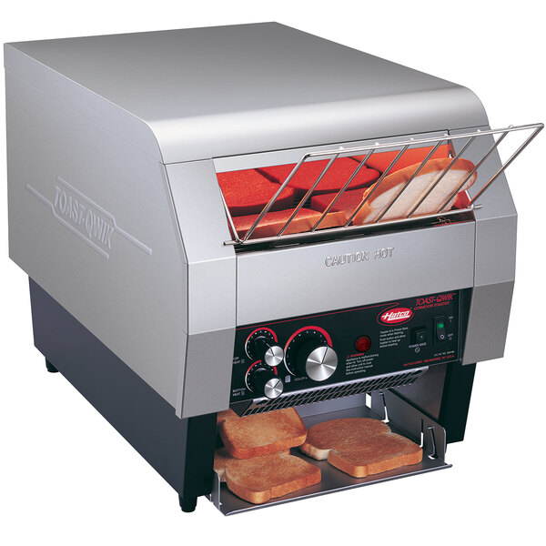 A Hatco TQ-400H conveyor toaster with bread inside.