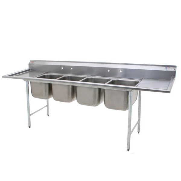 A stainless steel Eagle Group 4 compartment sink with two drainboards.