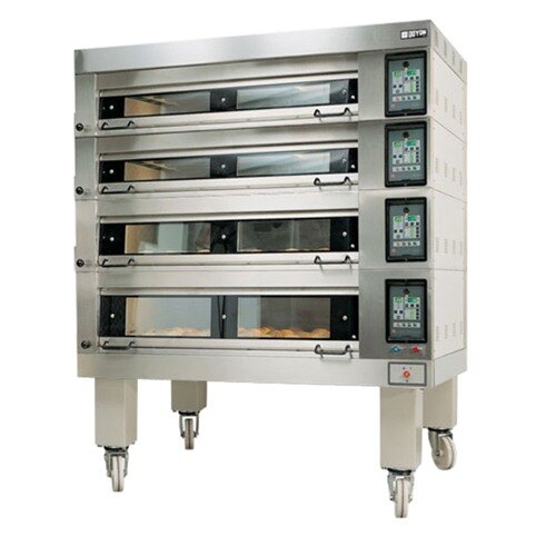 A large industrial oven with four trays.