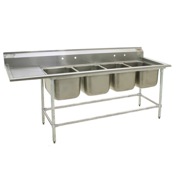 A stainless steel Eagle Group four compartment sink with two 28" x 20" bowls and a 24" left drainboard.
