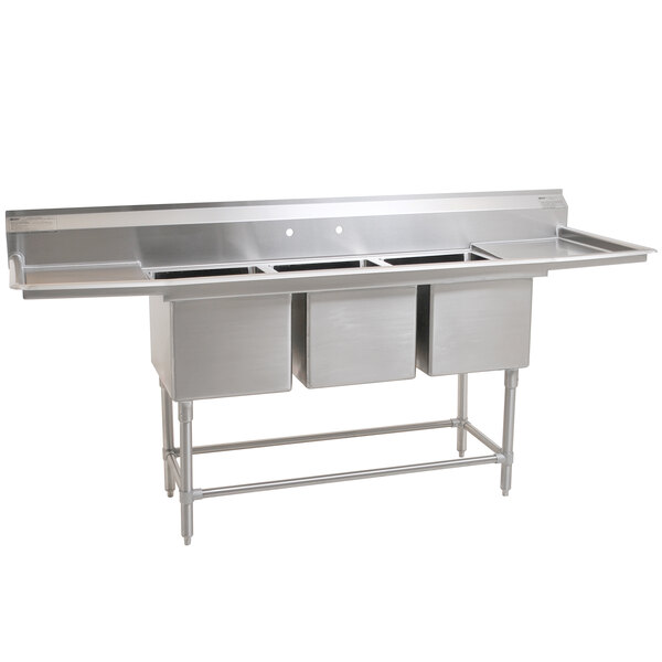 A stainless steel Eagle Group commercial 3 compartment sink with two drainboards.