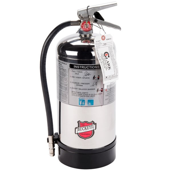 A Buckeye Class K fire extinguisher with a white label and a red tag.