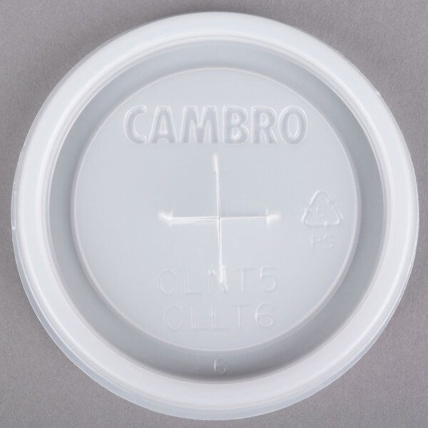 A white plastic Cambro lid with a straw slot and text.