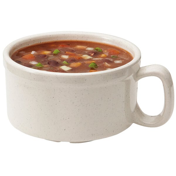 A white GET Santa Fe Ironstone mug filled with soup on a white background.