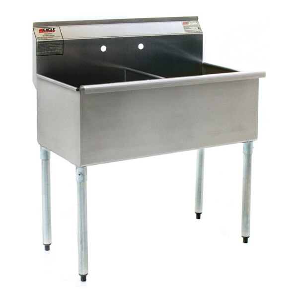 A stainless steel Eagle Group commercial sink with two drainboards and legs.
