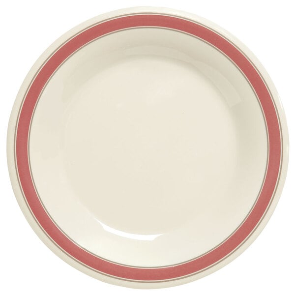 A close-up of a GET Diamond Oxford white plate with a red rim.