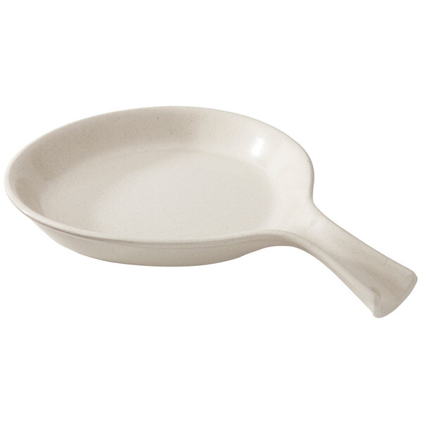 A white round pan with a handle.