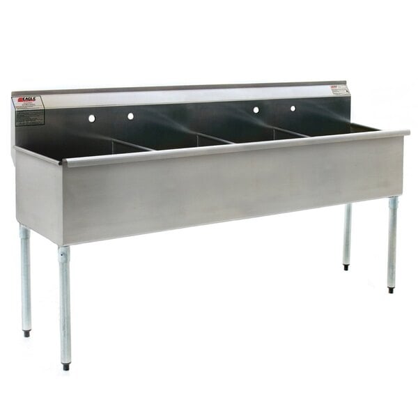 A stainless steel Eagle Group commercial sink with four compartments.