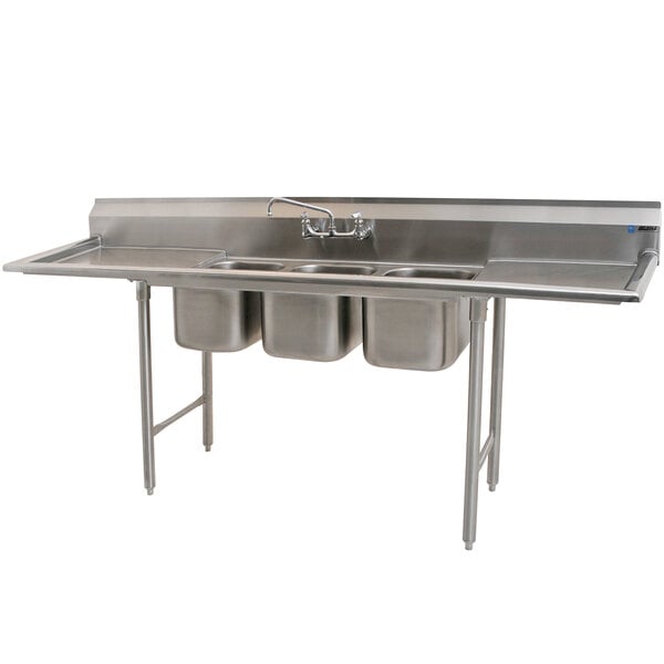 An Eagle Group stainless steel three compartment commercial sink with two drainboards.