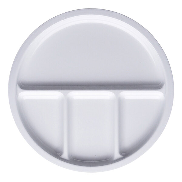 A white round melamine dish with four compartments.