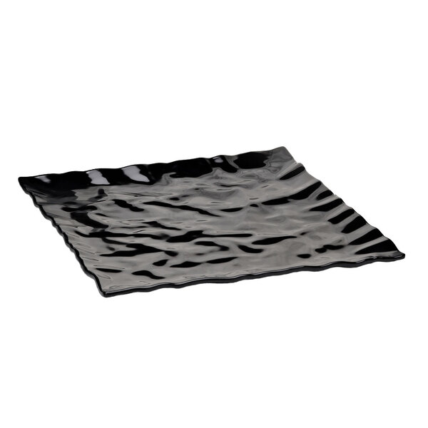 A black square melamine tray with wavy edges.