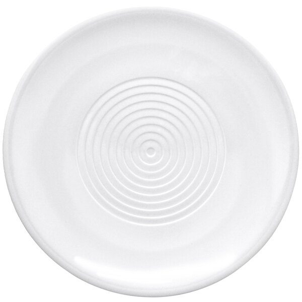 A white round melamine platter with a spiral pattern on it.