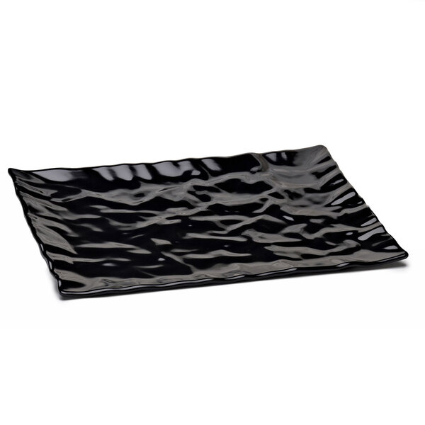 A black rectangular melamine tray with wavy edges.