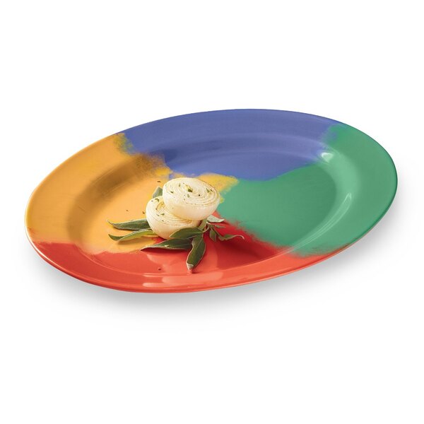 A white oval melamine platter with colorful food on it.