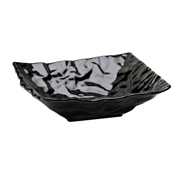 A black square bowl with wavy edges.