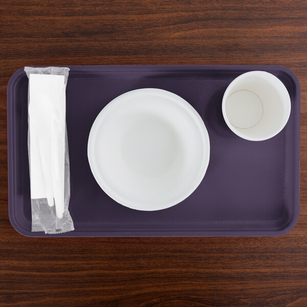 A white bowl and cup on a purple Cambro tray.