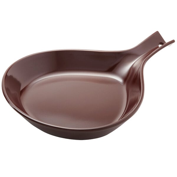 A brown skillet with a handle.