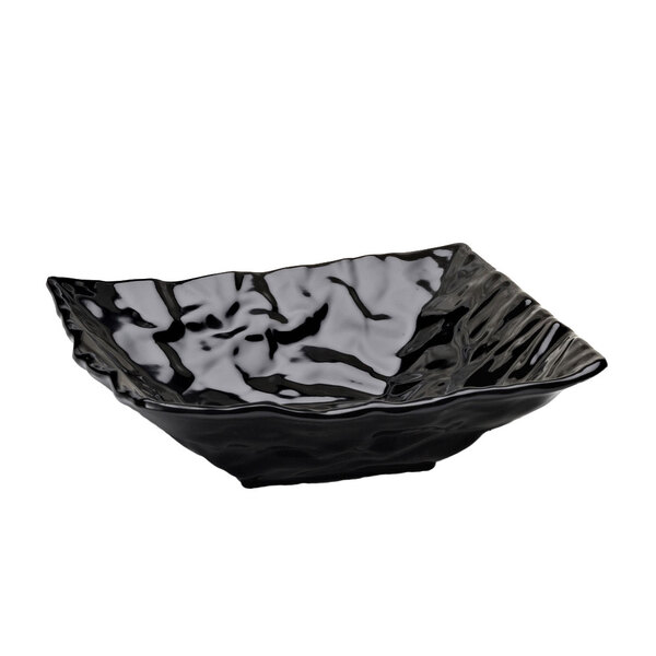 A black square Elite Global Solutions melamine bowl with wavy edges.