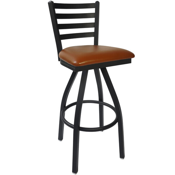 A BFM Seating black steel bar stool with a light brown vinyl swivel seat.