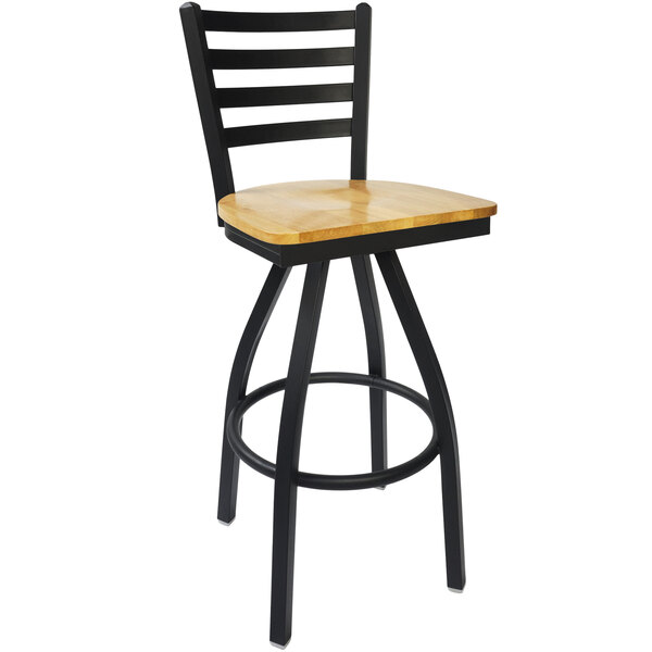 A BFM Seating black steel bar stool with a natural wood seat.