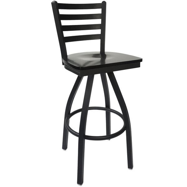 A BFM Seating black steel bar stool with black wood seat and back.