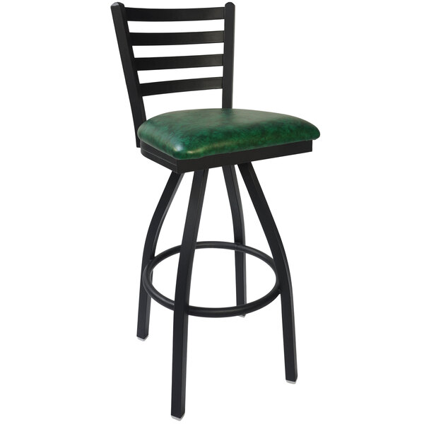 A black bar stool with a green cushion and black steel legs.