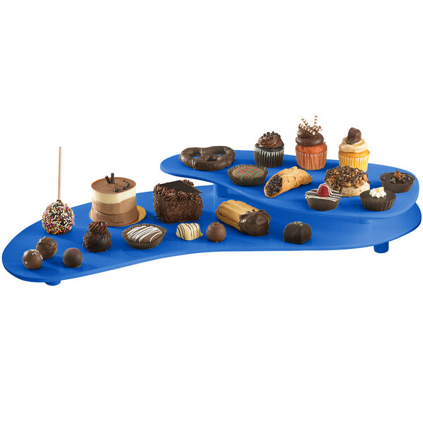 A Tablecraft cobalt blue two tiered platter with various desserts on it.