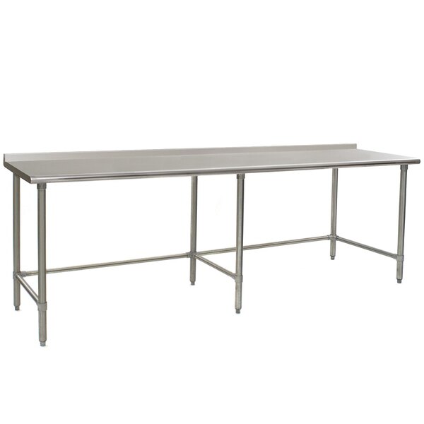A long Eagle Group stainless steel work table with metal legs.