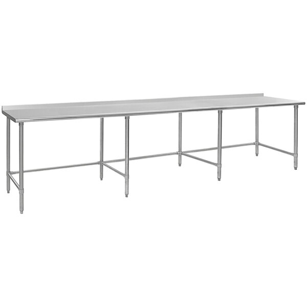 A long rectangular Eagle Group stainless steel work table with an open base.