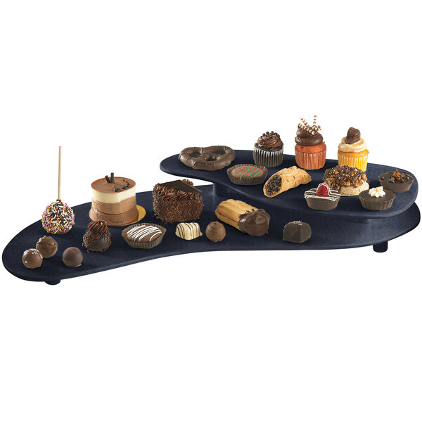 A black Tablecraft two tiered platter with various chocolate desserts on it.