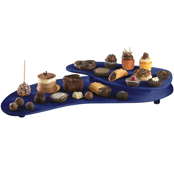 A Tablecraft blue speckled two tiered platter with various desserts on it.