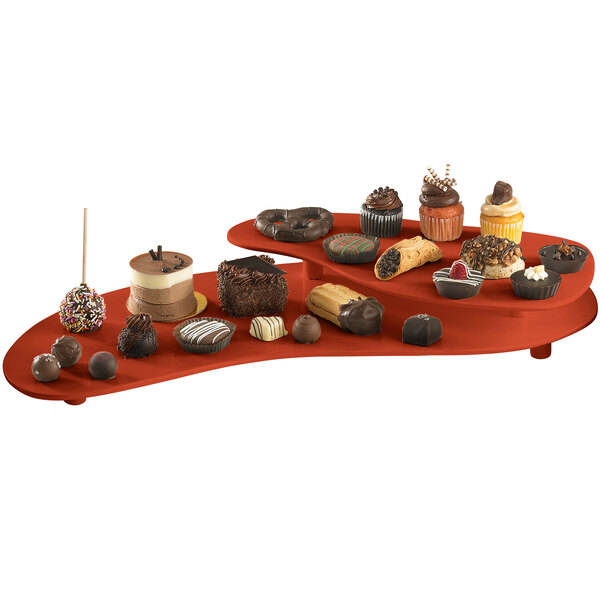 A Tablecraft copper two tiered platter with various chocolate desserts on it.