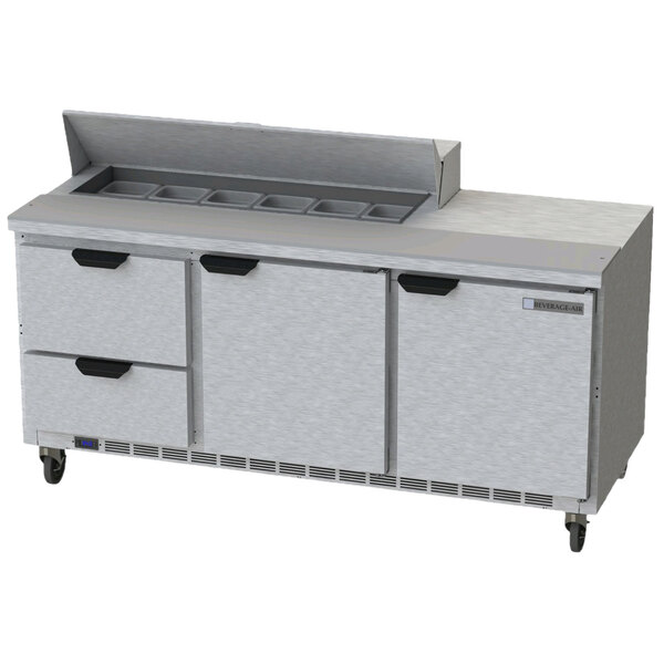A Beverage-Air stainless steel refrigerated sandwich prep table with drawers and a cutting board.