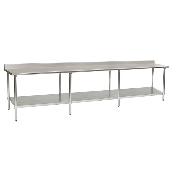 A long stainless steel Eagle Group work table with undershelf and backsplash.