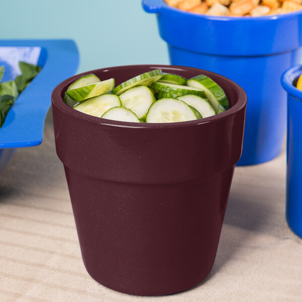 A Tablecraft maroon speckle condiment bowl filled with cucumbers.