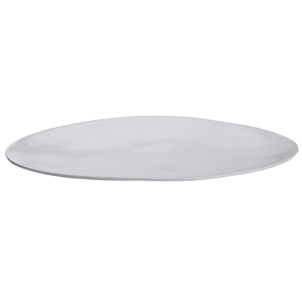 A natural cast aluminum oblong platter with a white surface.