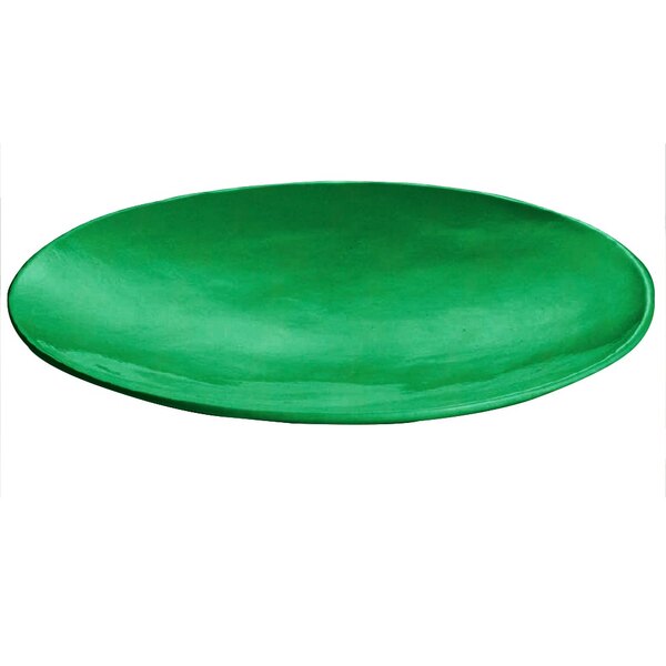 A green cast aluminum round flared platter on a white surface.