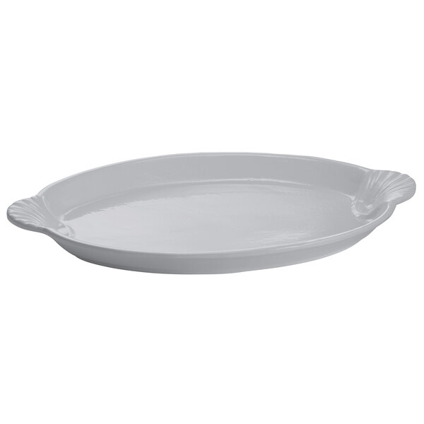 A natural cast aluminum oval shell platter with handles.