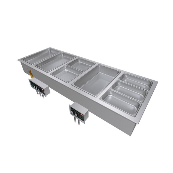 A Hatco drop-in hot food well with three compartments on a metal counter.